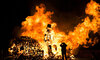 Man-takes-a-picture-during-a-bonfire-the-night-of-the-fifth-of-November-1200x720.jpg