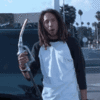 holding-a-gas-pump-zack-de-la-rocha.gif